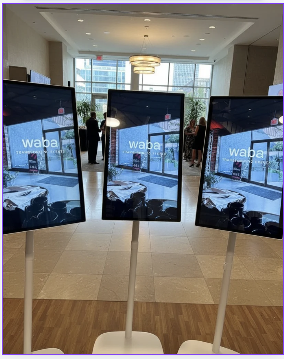 WABA welcome screens in an event lobby